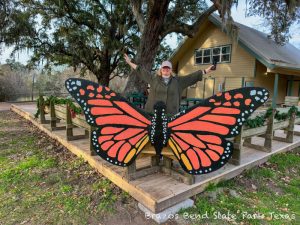 Wooden shelter surrounded by oak trees and Spanish moss.