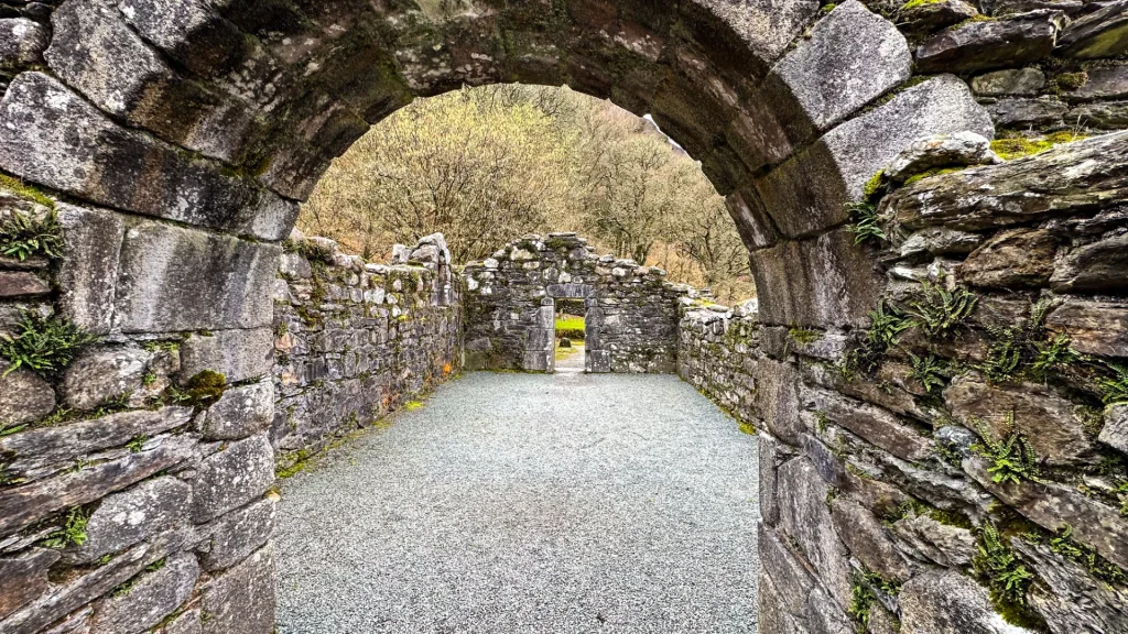 Stone arch inside Glendalough monastic ruins in Ireland